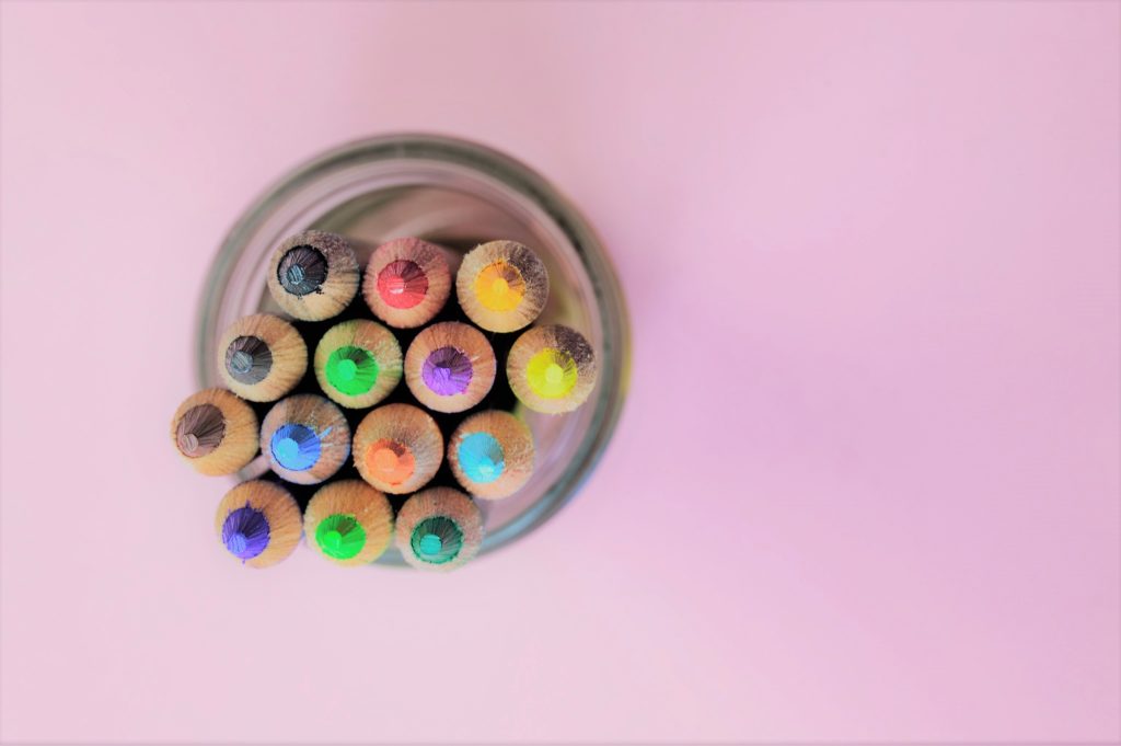 color pencils in a glass jar