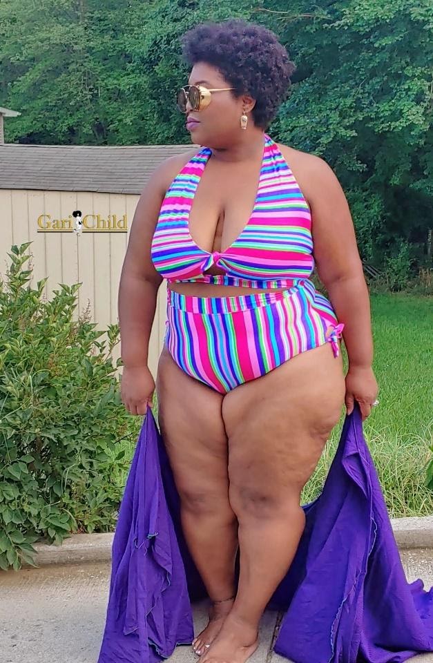 Model outside in a colorful striped swimsuit designed using her custom MyBodyModel fashion croquis