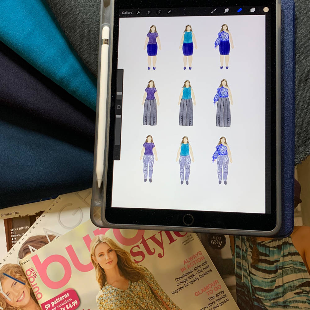 Sewing magazines, Apple Pencil, and iPad Pro with examples of drawings of outfits created using apps for fashion design sketching and MyBodyModel custom fashion croquis.