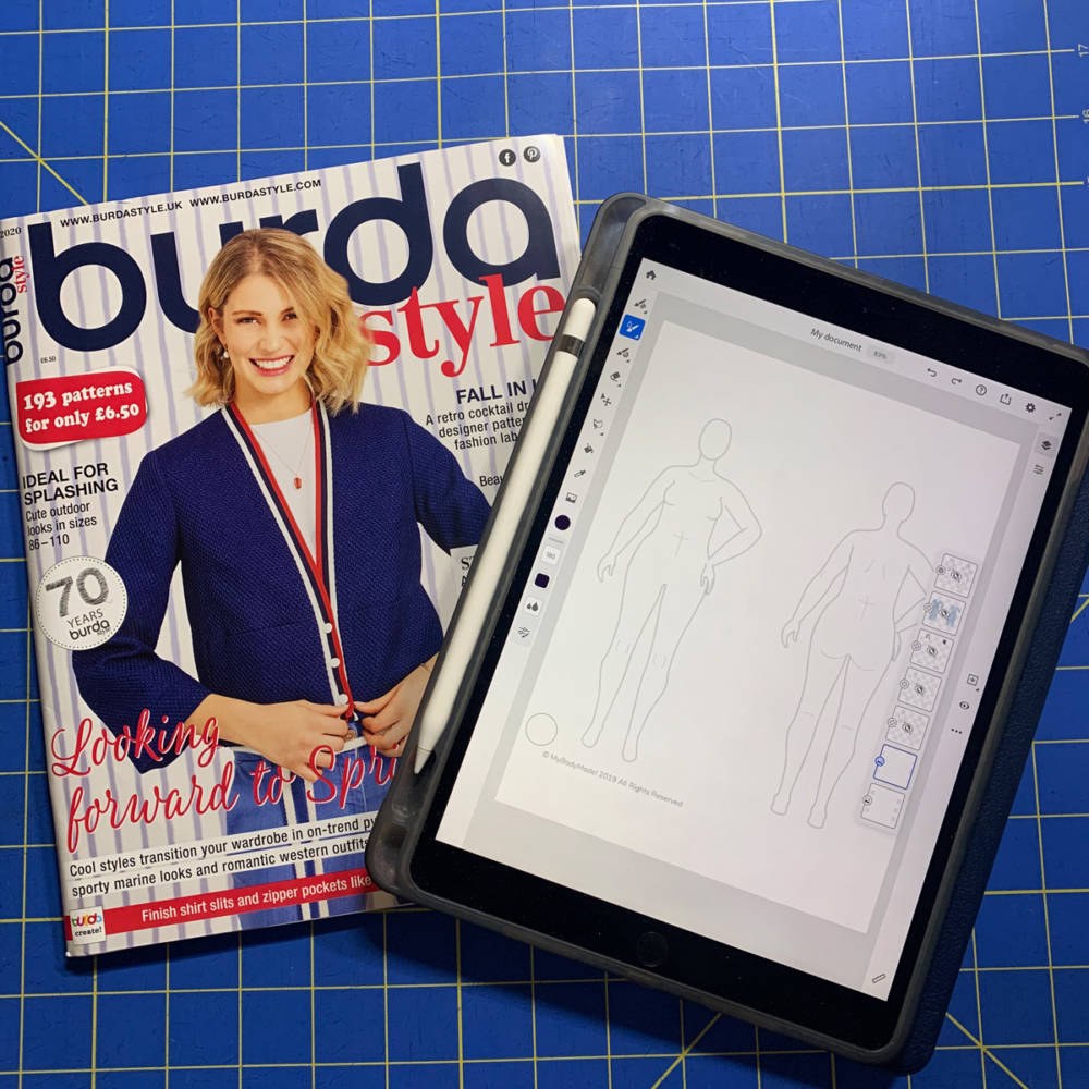 Flatlay of a Burda Style magazine, Apple Pencil and iPad Pro with MyBodyModel croquis file opened in the fashion design apps interface