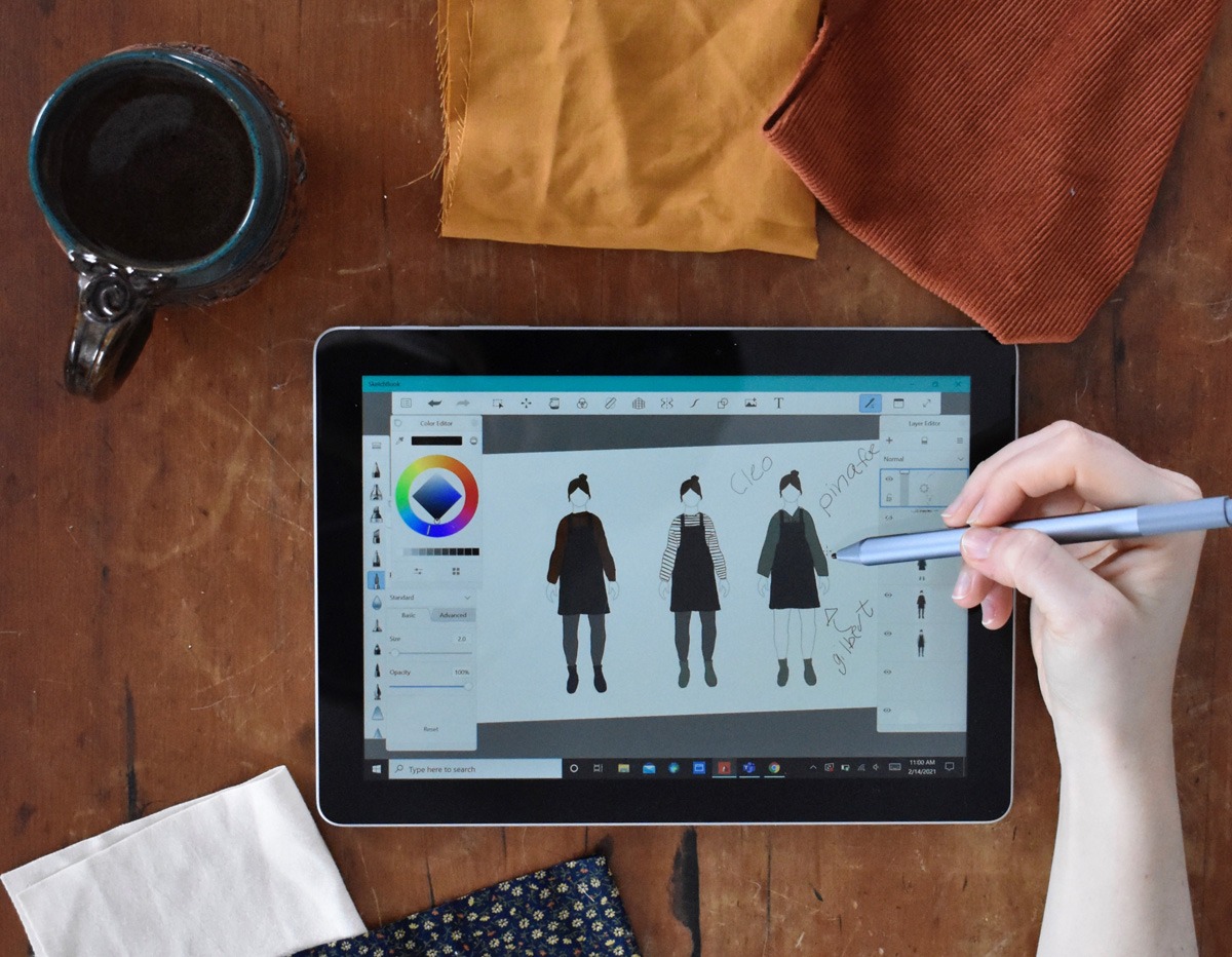 Alyssa using the app Sketchbook on her tablet to design her autumn capsule wardrobe on her MyBodyModel croquis.