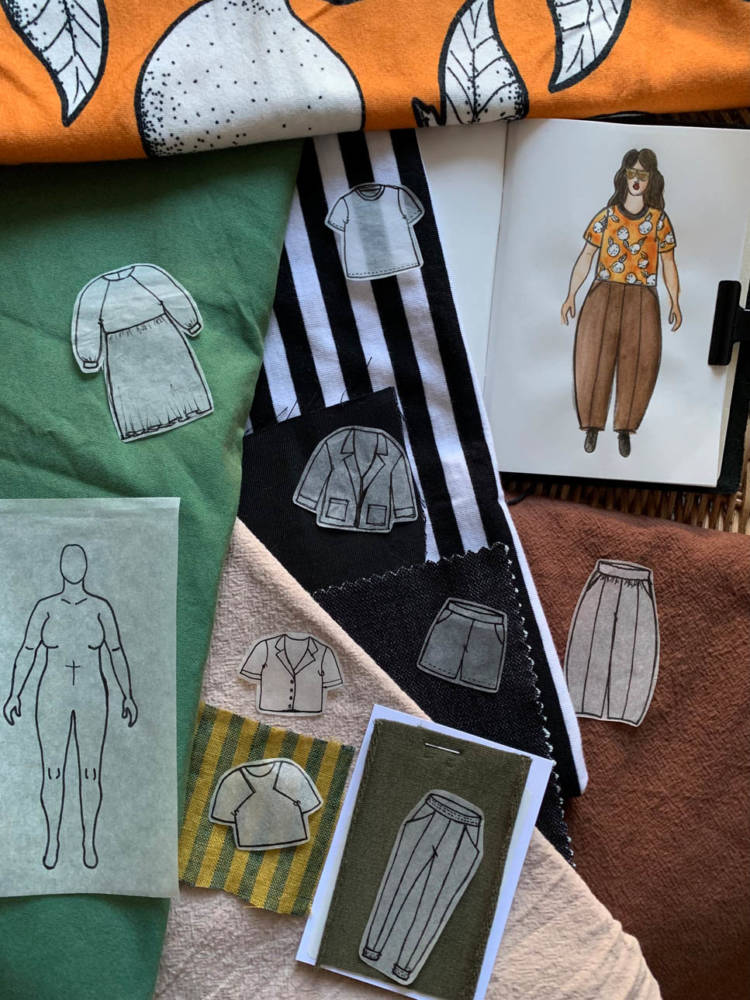 Eri’s Make Nine challenge wardrobe ideas: The Jackson Tee by Helen’s Closet in black and white cotton knit fabric and orange print cotton knit fabric, the Block Tee by Paper Theory Patterns in Chartreuse and Teal Striped Linen fabric, the Gilbert Top by Helen’s Closet in Milk Tea Sandwashed cotton fabric, the Pona Jacket by Helen’s Closet in black tencel twill fabric, the Hope Woven Dress by Style Arc in teal cotton poplin fabric, the Arenite Pants by Sew Liberated in Olive French terry fabric, the Arthur Pants by Sew Liberated in Baked Clay Sandwashed cotton fabric, and the Arden Pants by Helen’s Closet in Dark Wash Denim fabric.