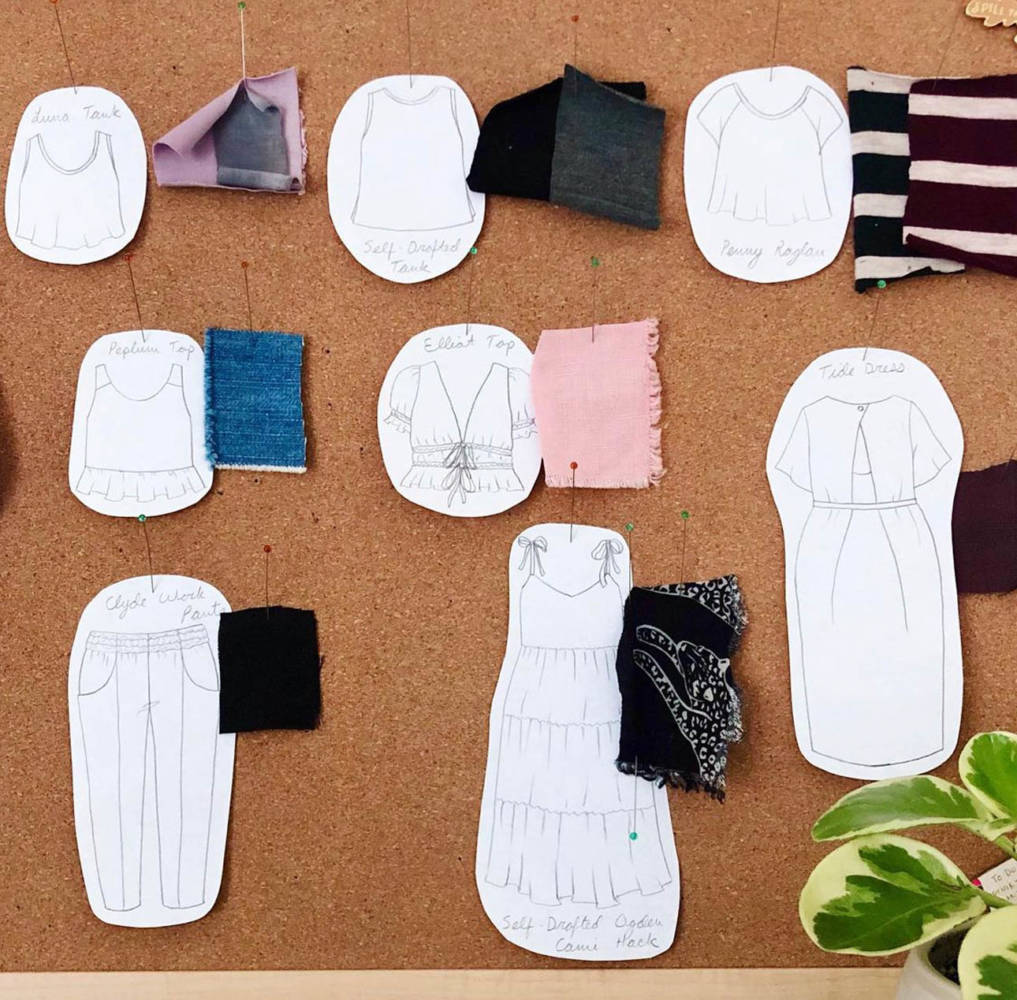A portion of Sarah's seasonal sewing & knitting corkboard with fabric swatches and paper drawings of her Summer 2021 wardrobe plans, sketched with her MyBodyModel croquis.