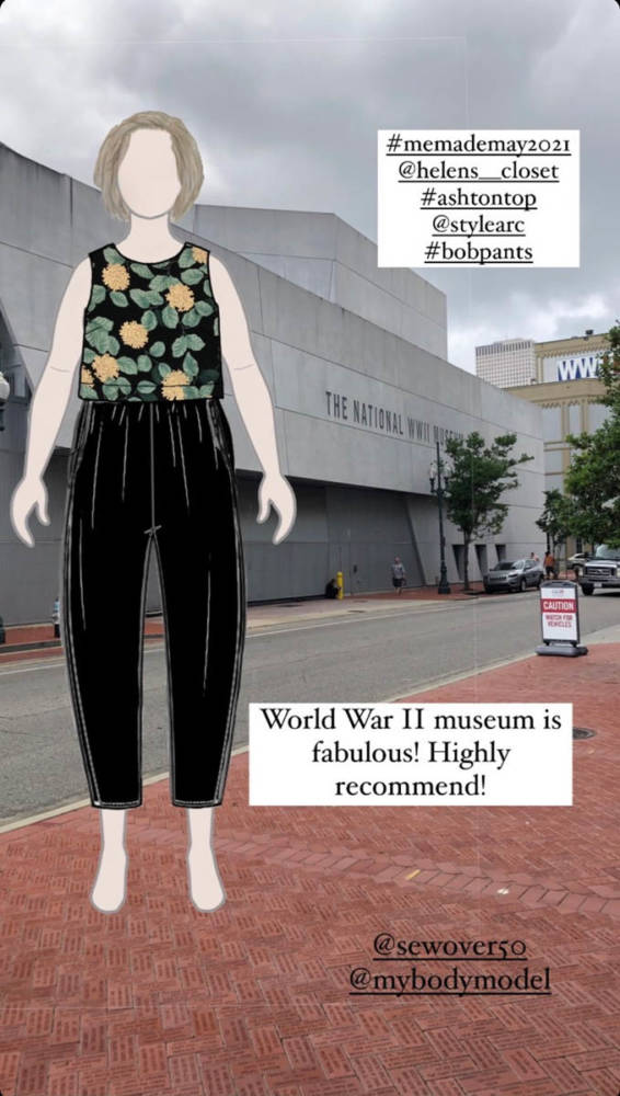 Pam's digital MyBodyModel croquis dressed in a Me Made May outfit of the Helen's Closet Ashton top and Style Arc Bob pants layered over a photo of The National WWII Museum. A textbox reads: "World War II museum is Fabulous! Highly recommend!"