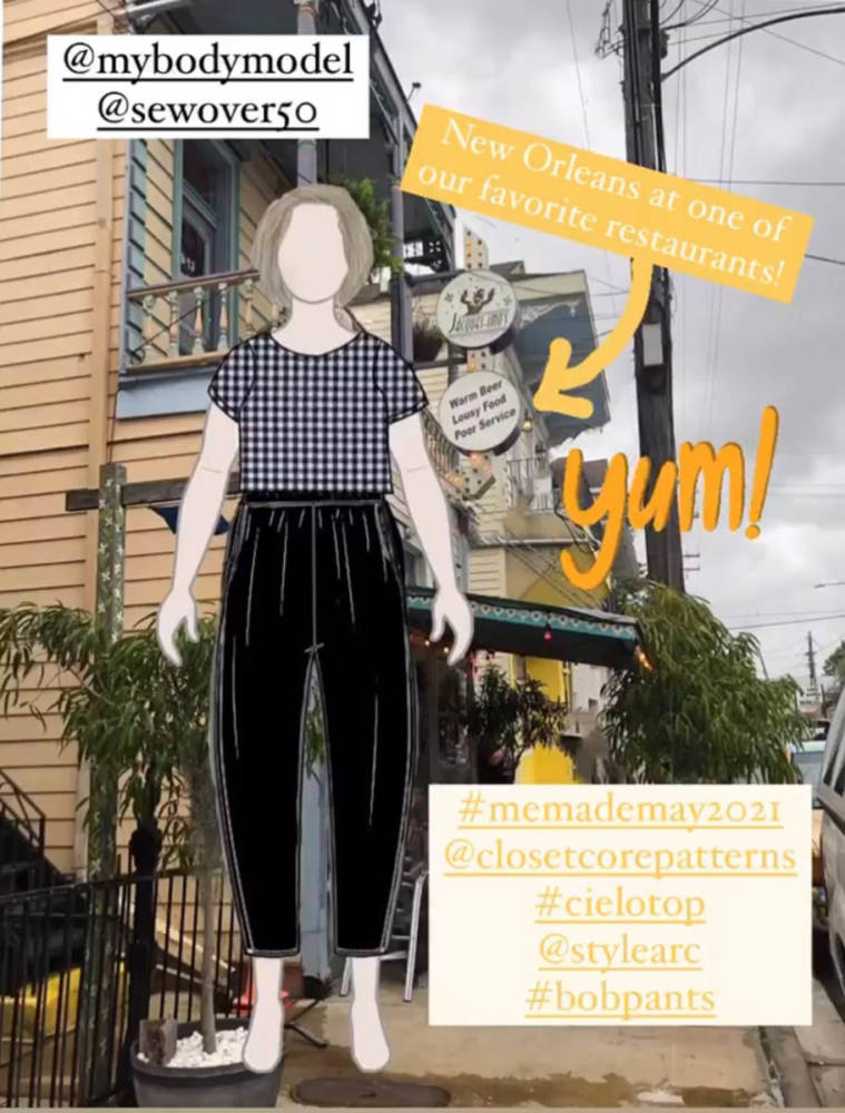 Pam's digital MyBodyModel croquis dressed in a Me Made May outfit of the Closet Core Cielo top and Style Arc Bob pants layered over a photo of a street with a row of yellow townhouse type buildings. A textbox reads: "New Orleans at one of our favorite restaurants!"