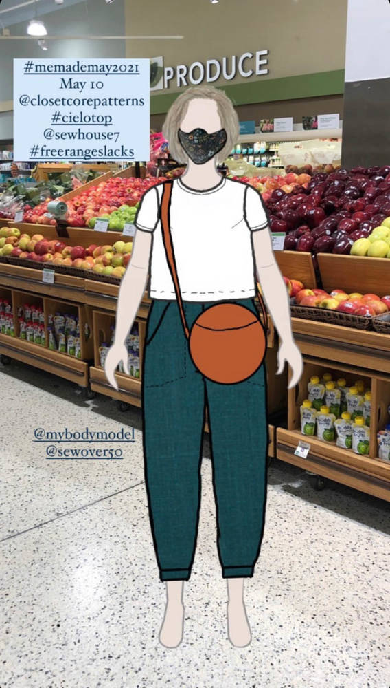Pam's digital MyBodyModel croquis dressed in a Me Made May outfit of the Closet Core Cielo top and Sewhouse 7 Free-Range Slacks and orange crossbody purse layered over a photo of the produce aisle in a grocery store.